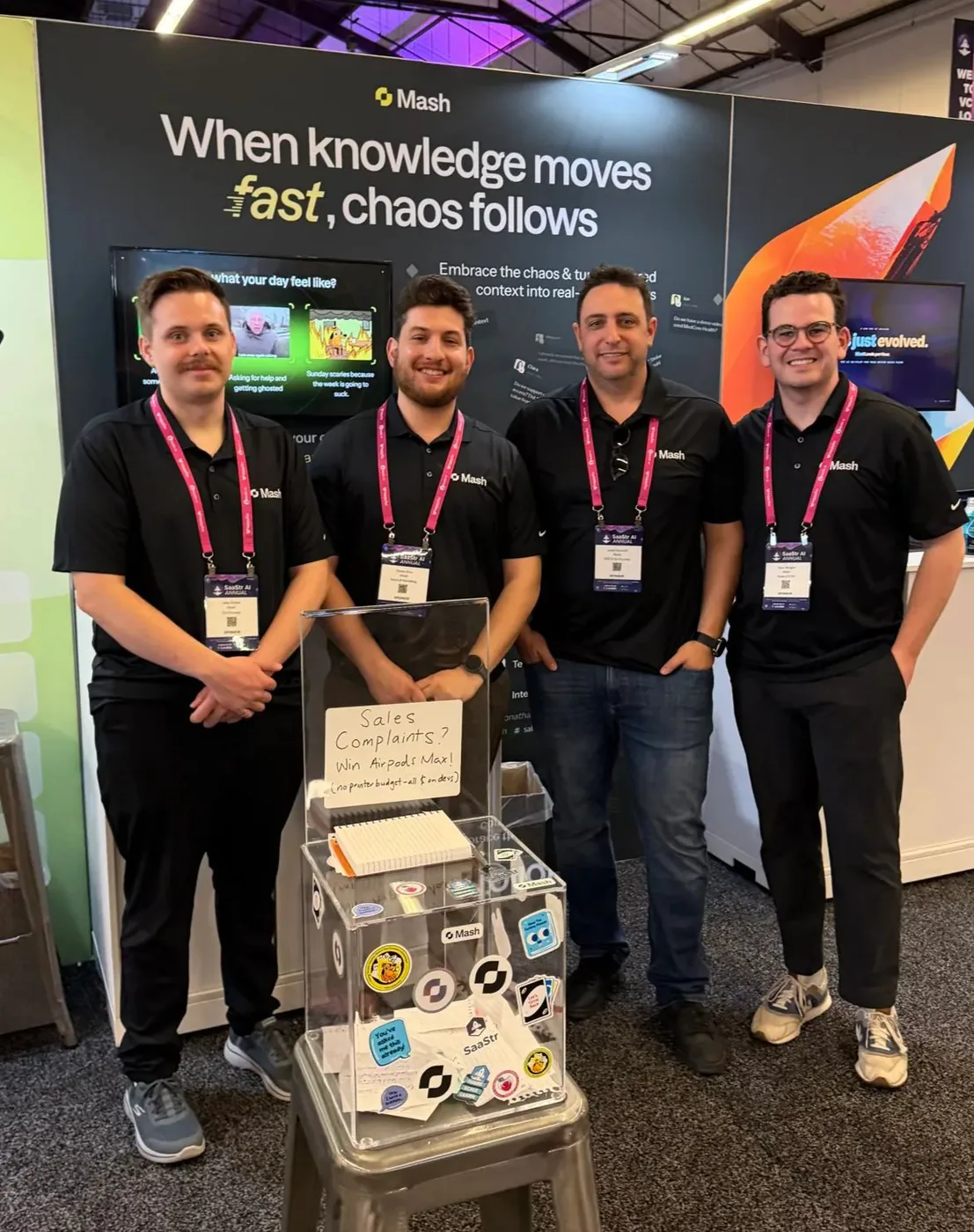 Four team members at the Mash booth at SaaStr